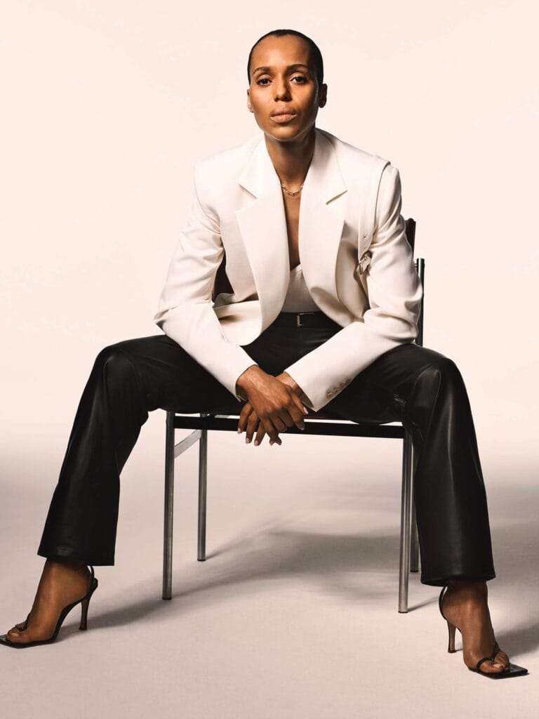 Kerry Washington: Sits on a chair with her legs apart and her arms relaxed on…