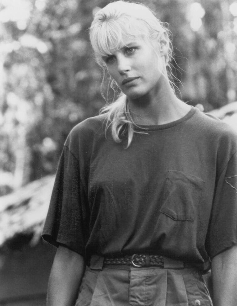 Daryl Hannah: Wears an oversized dark t-shirt and cargo pants in a neutral tone,…