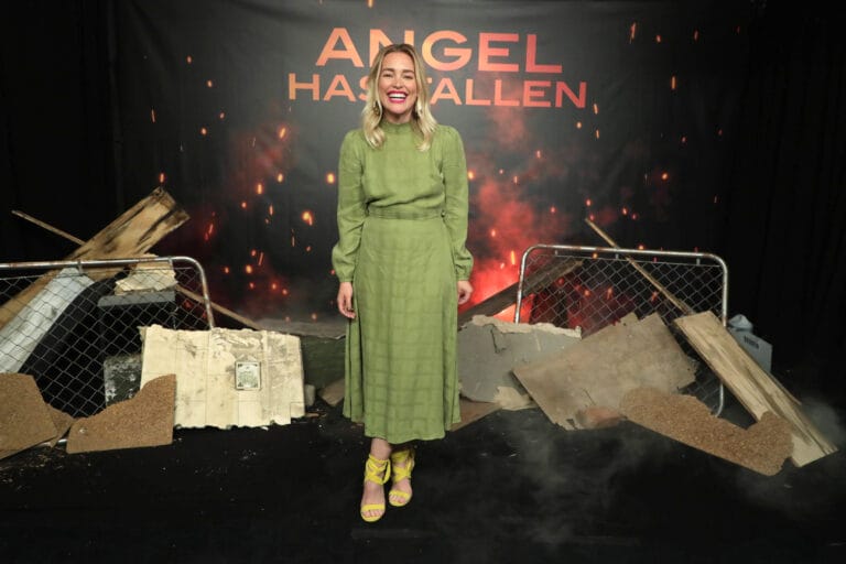 Piper Perabo: Wearing a green midi dress with long sleeves and a textured design…