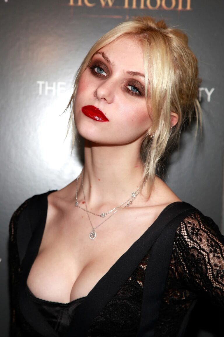 Taylor Momsen: Wearing a black lace dress that highlights her figure, leaving the…