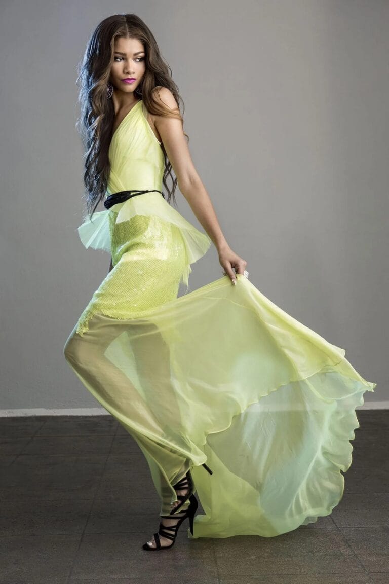 Zendaya: Wears a yellowish dress with an asymmetric design that combines a shiny part with…