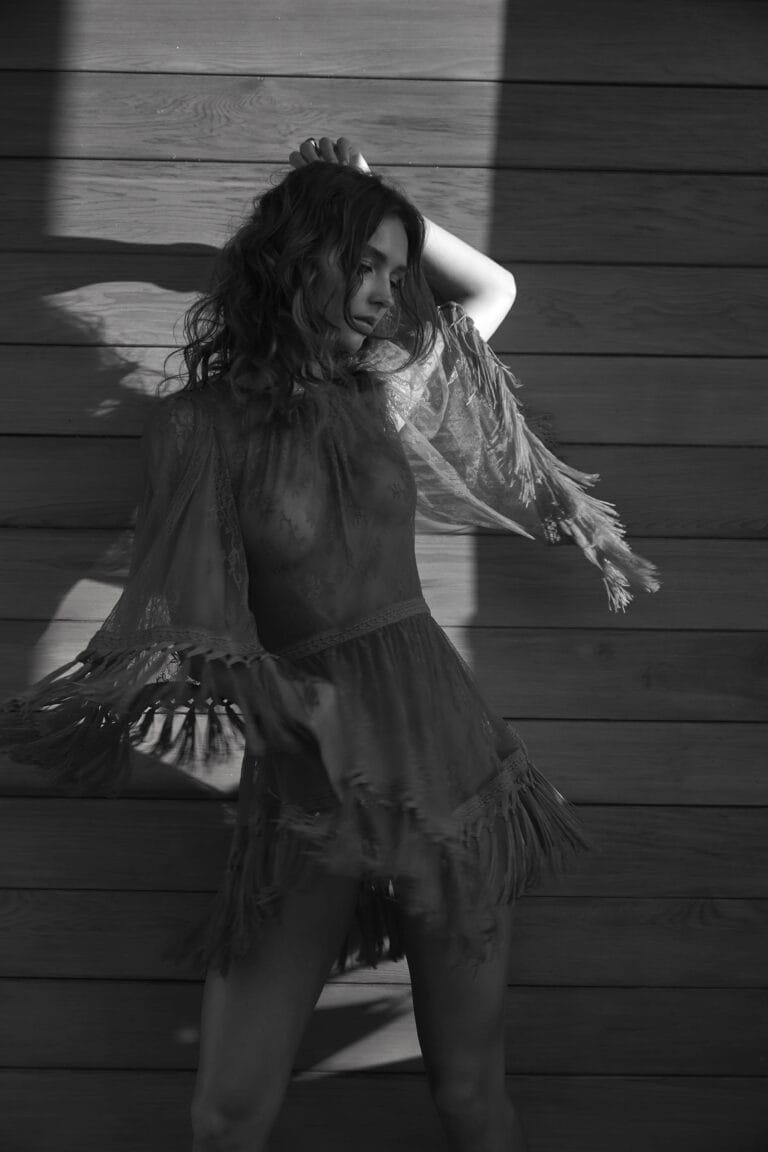 Rachel Cook: Wears a black lace dress with fringe that moves gracefully as…
